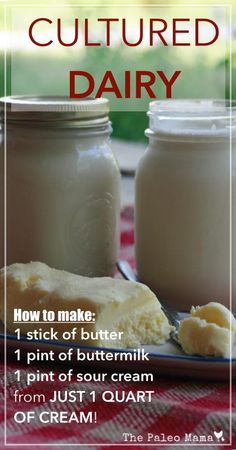 two jars filled with butter sitting on top of a red and white checkered table cloth