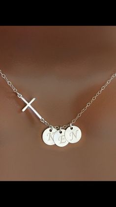 "Handmade with love! PERSONALIZED NECKLACE, CUSTOM INITIAL DISCS, CUSTOM JEWELRY, PERSONALIZED GIFTS. Personalized Sterling silver Cross and initial disc( s) charm necklace is great gift ideas for Christmas, for Baptism, birthday, Mother's day, gift for her, for mom, grandma, best friend, sister, your wife, daughter,... MATERIALS: - Silver Plated chain and components. - Silver Plated disc charm size 8mm. - Sterling silver Cross charm 9.4mm x 18.7mm. - The model is wearing a 17\" inches necklace Silver Cross Pendant Necklace For Personalized Gift, Silver Name Necklace With Cross Shape, Silver Cross Necklaces With Name Detail, Silver Cross Jewelry With Name, Silver Name Necklace With Cross Pendant, Silver Cross Pendant Necklace With Name, Personalized Cross Pendant Jewelry For Mother's Day, Silver Cross Pendant Necklace For Birthday, Personalized Cross Jewelry For Valentine's Day