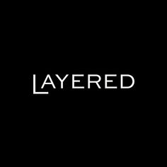 the word layered is written in white on a black background