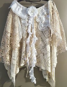 Imagine spinning around on the beach wearing this delightful boho skirt!  I spent many hours designing and sewing this absolutely beautiful bohemian style skirt using all Vintage and Antique reclaimed lace of various kinds.  Both French and Italian, exquisitely detailed Lace!   It features a Dragonfly motif sewn onto an Antique bobbin lace doily and lengths of lace, ribbon, satin and crinkled pure silk to create an extra shabby feel.  I made an extremely delicate layered lace flower to adorn the Doily Skirt, Bohemian Style Skirts, Bridal Skirt, Bridal Skirts, Fairy Skirt, Bohemian Style Clothing, Alternative Bridal, Bohemian Skirt, Lace Doily