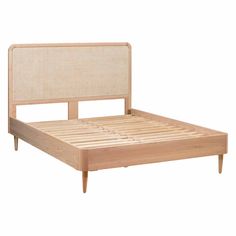 the bed frame is made from wood and wicker