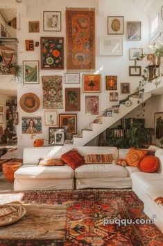 a living room filled with furniture and lots of pictures on the wall next to stairs