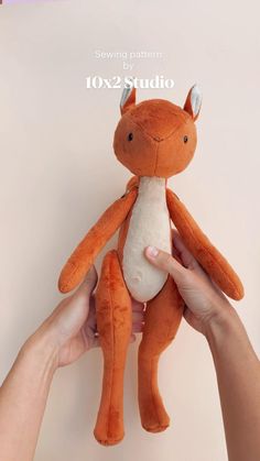 a person holding a stuffed animal in their hands with the caption saying sewing pattern by fox studio