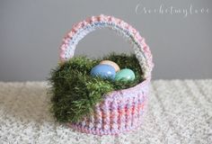 an easter basket with grass and eggs in it