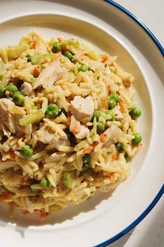 a white plate topped with rice and peas