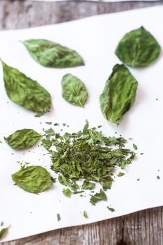 spinach leaves on a cutting board with seasoning