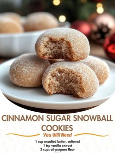 cinnamon sugar snowball cookies on a white plate