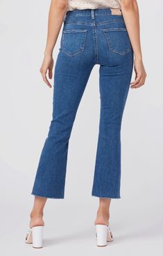 This high-rise cropped flare is slim through the hip and thigh with a kick flare below the knee that finishes above the ankle with a raw hem. Cut from our TRANSCEND VINTAGE denim in a medium blue, elevated daytime wash, this style has the look of authentic vintage denim but is incredibly comfortable with plenty of stretch and recovery. Rise: 10” Inseam: 26 1⁄2” Leg Opening: 16 3⁄4” 92% Cotton, 6% Polyester, 2% Spandex Crop Flare, Cropped Flare Jeans, Kick Flares, Cropped Flares, Contemporary Outfits, Paige Denim, Denim Flares, Ladies Boutique, Vintage Denim