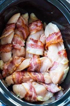 bacon wrapped chicken in the crock pot ready to be cooked and put into the slow cooker