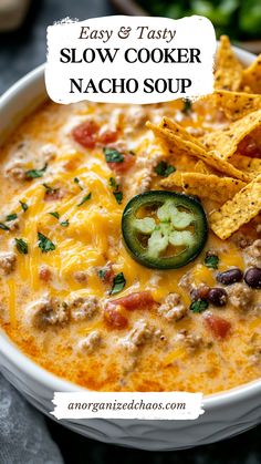 easy and tasty slow cooker nacho soup in a white bowl with tortilla chips