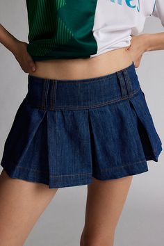 Reinvented Kimchi Blue denim short with a pleated, preppy twist. Designed with a low-rise, elasticated-back waistband and pleated legs in a micro mini length. Only at Urban Outfitters. Features Kimchi Blue Blaire pleated denim micro short Pleated micro short Rigid denim that softens with wear Low rise waist with wide band and belt loops Flare pleated leg A-line silhouette Micro mini length Pull-on style UO exclusive Content + Care 100% Cotton Machine wash Imported Size + Fit Model in Indigo is 5’10" and wearing size Small Measurements taken from size Small Inseam: 1" | Kimchi Blue Blaire Pleated Denim Micro Short in Indigo, Women's at Urban Outfitters Low Rise Mini Denim Skirt, Low Waisted Denim Skirt, Cute Concert Outfit Ideas, Blue Mini Skirt Outfit, Mini Pleated Skirt Outfit, Pleated Skirt Outfit Short, Denim Skirt Pleated, Pleated Mini Skirt Outfit, Cute Concert Outfits