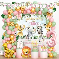 an animal themed birthday party with balloons and decorations