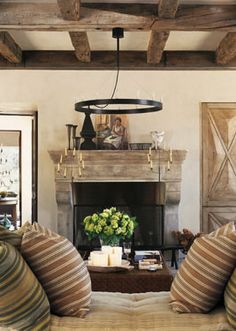 a living room filled with furniture and a fire place