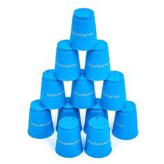 a stack of blue plastic cups sitting next to each other on top of a white surface