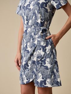 Women's Faux Wrap Dress | Resort to Sport Styles | A. PUTNAM Cotton Dresses With Tie Fastening For Work, Cotton Dress With Tie Fastening For Work, Cotton Workwear Dresses With Tie Fastening, Blue Fitted Dress With Tie Fastening, Fitted Midi Dress With Tie Fastening For Daywear, Fitted Blue Dress With Tie Fastening, Fitted Cotton Midi Dress With Tie Waist, Elegant Fitted Cotton Wrap Dress, Fitted Tie Waist Shirt Dress For Summer