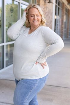 Feel stylish and comfortable with the Leah Long Sleeve Top in Light Grey. This classic design features cozy thumbholes, making it perfect for any adventure, whether indoors or out. With its ideal stretch, it pairs wonderfully with a vest for a versatile and chic look. Fabric: 65% cotton, 30% polyester, 5% spandexFit: True to sizeModel Sizing: Tiffanee is wearing a small, Lexi is wearing a 1XL Athleisure Dress, Graphic Tee Dress, Casual Tops For Women, Pajama Bottoms, Romper Dress, Grey Women, Tee Dress, Casual Top, Dress Romper