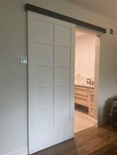 an open door leading to a bathroom in a house