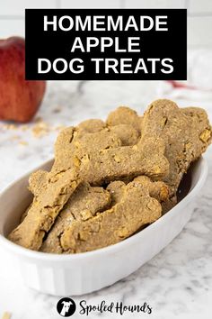 homemade apple dog treats in a white bowl with an apple behind it and text overlay that reads homemade apple dog treats