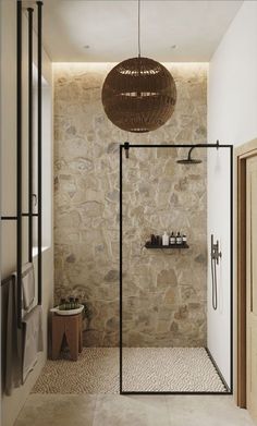 a bathroom with stone walls and flooring