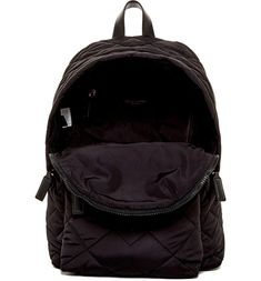 Stay stylish and organized all year with the Quilted Nylon School Backpack. Crafted from durable nylon with a plush quilted design, this backpack offers luxury looks and practical packing space. A spacious 14' main compartment fits your books, folders and gear. Internal and external pockets keep smaller items handy. Adjustable straps and a top carry handle provide versatile transport. Perfect for students on the go. Luxury Quilted Backpack For Travel, Luxury Quilted Travel Backpack, Nylon Bags For On-the-go And Back To School, Nylon Bag For On-the-go And Back To School, Nylon Bags For Back To School And On-the-go, Luxury Nylon Standard Backpack, Nylon Backpack With Adjustable Strap For Overnight Trips, Quilted Backpack For Travel And Back To School, Back To School Travel Backpack With Quilted Detail