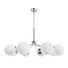 a chandelier with five white balls hanging from the ceiling