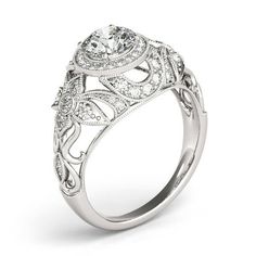 a white gold engagement ring with an intricate design