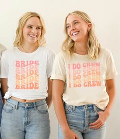 two young women wearing matching t - shirts with the words bride and babe on them