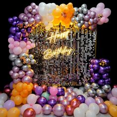 an image of balloons and streamers in front of a photo frame with the words happy new year on it