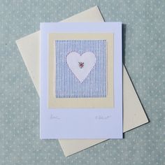 two greeting cards, one with a heart and the other with a bee on it