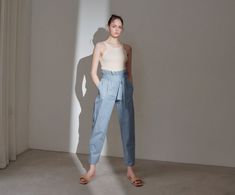 Long 100% cotton trousers. High waisted with ruffle and belt. Model is in MINUSEY ONE SIZE. Please allow 5-12 days shipping when in restocking. * MINUSEY ONE SIZE = EU 34-38, US 2-6* 100% Cotton* Dry clean* Made in Korea - Model Height: 170cm/5'7" (US2, EU34) High Waist Cotton Pants With Belt, Spring Tapered Leg Bottoms With Belt, Summer Cotton Bottoms With Belt, High Waist Cotton Bottoms With Ruffles, High Waist Cotton Pants With Ruffles, Belted Cotton Trousers, Summer Pants With Belt, Summer Trousers With Belt, Cotton Paperbag Waist Pants With Belt Loops