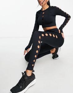 Trendy Black Hollow Out Crop Top, Trendy Black Crop Top For Workout, Trendy Black Seamless Crop Top, Black Stretch Crop Top With Cutout, Black Breathable High Stretch Crop Top, Black High Stretch Breathable Crop Top, Black Stretch Crop Top With Hollow Details, Trendy Black Crop Top For Yoga, Seamless Crop Top