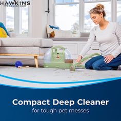 a woman is cleaning the floor with a vacuum