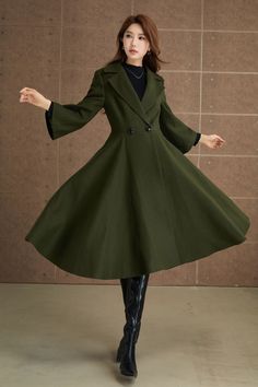 Step out in style with this stunning green wool coat, perfect for adding a touch of sophistication to your winter wardrobe. The double-breasted front is adorned with sleek black buttons, complementing the wide lapels and long sleeves.It a standout piece for any occasion.  DETAIL * 50% wool blend, 50% fiber,nylon * Polyester lining * Long sleeves , flared sleeves coat * Two side pockets * Double breasted button fastening  * Fit and flared coat * Swing wool coat * Mid-calf length wool coat * Perfect for autumn winter * Dry clean MODEL SIZE Bust 85 cm(33.4") Waist 67 cm(26.7") Height 168cm (5' 6") She wears size XS Choose CUSTOM Order if you * Need a better fit * Can't find your size in our size Chart * Change the Style * Chang the Length * Your Height is not Between 5'1" - 5"9" * Your weight Solid A-line Outerwear For Fall, Spring Wool Coat In Solid Color, Fall A-line Single Breasted Outerwear, Spring Wool Coat With Stand Collar, Spring Wool Long Pea Coat, Winter Wool Coat For Office, Solid Color Wool Coat For Winter, Winter Office Pea Coat In Solid Color, Winter Office Pea Coat With Stand Collar