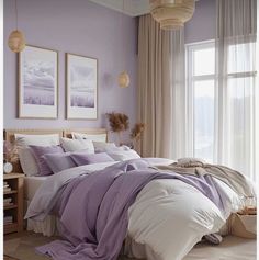 a bedroom with purple walls and white bedding