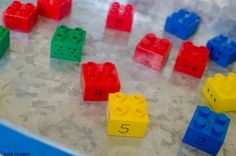 colorful legos with numbers on them sitting on a table