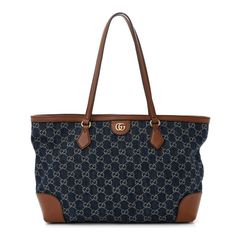 This is an authentic GUCCI New Denim GG Monogram Medium Ophidia Shopping Tote in Blue Tea Cuir. This chic tote is crafted of Gucci GG monogram denim canvas. The handbag features brown leather strap handles and the top is open to a beige fabric interior with zipper and pockets. Gucci Ophidia Tote, Gucci Ophidia Bag, Blue Tea, Gucci Tote Bag, Gg Monogram, Gucci Monogram, Gucci Tote, Gucci Shoulder Bag, Brown Leather Strap