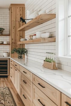 a kitchen with wooden cabinets and white tile backsplash, wood flooring and open shelving