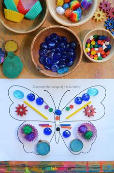 the butterfly is made out of plastic and surrounded by other crafting materials, such as cupcakes