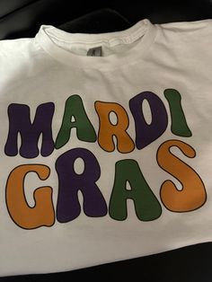 a t - shirt that says mardi gras on it