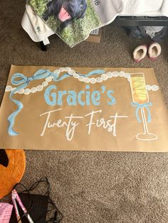 a sign that says gracie's twenty first with a dog on it