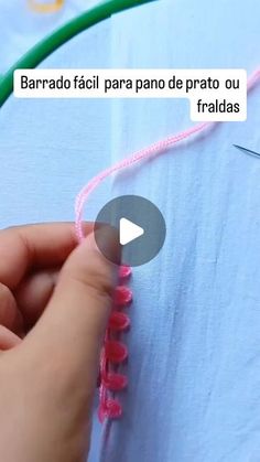 someone is stitching together pink thread on a blue shirt with green cord and text that reads, barrao facii para pra de prano de prato ou frato ou fridadas