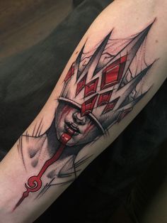 a man's arm with a tattoo on it that has an image of a ship