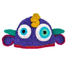 a crocheted purple hat with large eyes