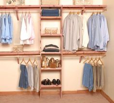 an organized closet with clothes, shoes and other items on shelves in the corner between two walls