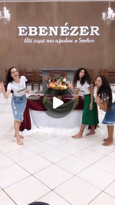 three girls standing in front of a table with food on it and the words ebenezzer above them