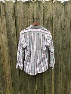 This is a great button up that isn't flashy or crazy, just simple and cool. It will look great with anything and is ready to go. It is in great condition and has no rips, holes, stains or smells. Measurements: Pit to pit: 22 1/4 inches Collar to bottom front: 23 3/4 inches Collar to bottom back: 26 inches Sleeve Length (from collar): 27 3/4 inches Size on tag: Medium 90s Style Cotton Button-up Shirt, 90s Style Cotton Shirt With Buttons, 90s Style Long Sleeve Shirt With Button Closure, 90s Style Collared Shirt With Button Closure, 90s Fall Button-up Tops, 90s Style Buttoned Tops For Spring, Painters Pants, Biker Shirts, Vintage Vans