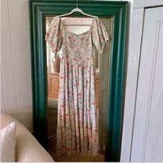 Nwt April Cornell Floral Smocked Maxi Dress Size Xs Floral Print Cotton Maxi Dress With A Smocked Bodice, Ties At Back, Puff Sleeves And A Pleated Skirt With A Ruffle Hem. 100% Cotton. Approx Measurements Pit To Pit: 16” Waist: 15” Across Length: 50” Bohemian Smocked Puff Sleeve Dress, Bohemian Smocked Puff Sleeve Dress For Brunch, Bohemian Fitted Smocked Dress With Puff Sleeves, Bohemian Smocked Dress With Puff Sleeves For Brunch, Fitted Bohemian Smocked Dress With Puff Sleeves, Flowy Bohemian Smocked Top, Bohemian Smocked Top With Short Sleeves, Bohemian Short Sleeve Smocked Top, Multicolor Flowy Smocked Dress