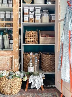 an open closet with baskets and other items