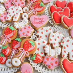 many decorated cookies are on a doily