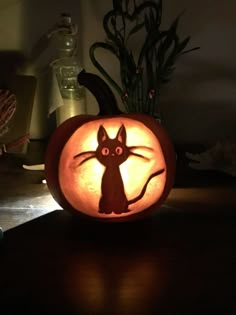 a pumpkin with a cat carved into it